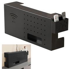 an electronic device is attached to the back of a wall mounted shelf with two remote controls