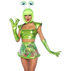 a woman dressed in a green costume with monster eyes and hands on her hip, posing for the camera