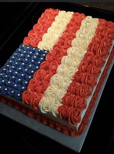 an american flag cake with red, white and blue frosting