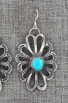 These turquoise and sterling silver earrings were made by Navajo silversmiths Eva & Linberg Billah. The back is signed L and stamped sterling.Length: 2"Width: 1"Free shipping on all orders! We ship with USPS and always include tracking. All orders ship within a day of payment.Returns are accepted up to 30 days after you receive your order. Just send us a message. Our shop offers cash back or store credit. The item must be returned in new condition. Artisan Turquoise Concho Earrings, Turquoise Sterling Silver, Sterling Silver Earrings, Silver Earrings, Turquoise, Sterling Silver, Free Shipping, Silver