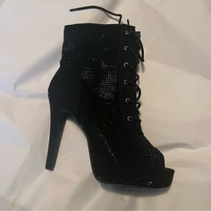 Ankle Booties With Sparkle. Never Worn And Will Ship With Plastic Coverings Over The Shoes. Small Imperfection (Purchased Like That) Shown In Photo. (Sequin Is Missing) Open Toe. Laces. Zipper Wide Width And Wide Calf Friendly. Torrid Shoes Tend To Run A Half To Whole Size Large So Anyone With A Size 9.5 To 10.5 Could Probably Wear Them. Winter High-top Heels For Night Out, Winter Party Lace-up Booties, Black Lace-up Boots For Winter Evenings, Party Lace-up Winter Booties, Black Ankle-high Lace-up Boots For Party, Medium Width High-top Heels For Party, High-top Party Heels Medium Width, Black High-top Heels For Night Out, Party Ankle Lace-up Boots Medium Width