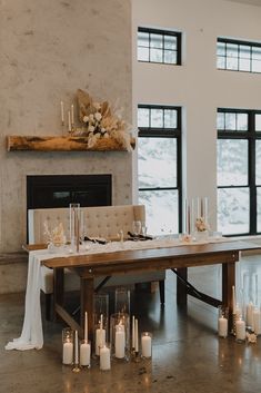 Dried florals, glass votives with candles and a tan color palette accompany a wooden sweetheart table. Neutral Sweetheart Table, Head Table Candles, Rustic Sweetheart Table, Wedding Sweetheart Table Decor, Wedding Couple Table, Minimal Wedding Decor, Luxury Romance