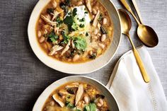 two bowls of chicken and bean soup with sour cream