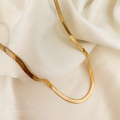 Slither into style with the Alex Snake Chain! Guaranteed to give you a golden look, this luxurious snake chain will make sure you stand out from the crowd. Slip it on and show off your fierce fashion sense. Great for layering, or worn alone! Material: 18k gold plated on stainless steel Length: 16" + 2" extender Width: 3mm Trendy Gold Plated Snake Chain Necklace, Trendy Gold Snake-shaped Chain Necklace, Trendy Gold Snake Shape Chain Necklace, Everyday Snake Chain Necklace, Trendy Metal Snake Chain Necklace, Trendy Gold Snake Chain Necklace, Minimalist Gold Snake Chain Necklace, Trendy Gold Snake Chain Necklace With Delicate Chain, Trendy Gold Snake Chain Necklace With Adjustable Chain