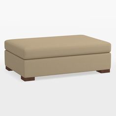 a beige footstool sitting on top of a white floor