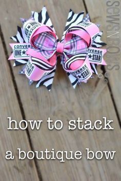 a pink and black bow with the words how to stack a boutique bow on it