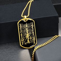 "This Nam Myoho Renge Kyo Necklace Is the Perfect Gift Whether for Yourself or a Loved One.  Explore all our Inspirational jewelry here: https://www.etsy.com/in-en/shop/SymbolicPresent?ref=seller-platform-mcnav§ion_id=31033166 ➜ Our jewelry is made of high-quality surgical steel with a shatterproof liquid glass coating and an 18k gold finish option. ➜ Engrave onto the back of the Nam Myoho Renge Kyo pendant your loved one's name, your wedding date, an anniversary, or anything else you want to re Rectangular Gold Jewelry For Ceremonial Occasions, Ceremonial Gold Rectangular Jewelry, Rectangular Gold Ceremonial Jewelry, Spiritual Good Luck Rectangular Pendant Jewelry, Personalized Brass Amulet Jewelry, Bohemian Engraved Jewelry For Good Luck, Symbolic Stamped Necklace For Gift, Symbolic Stamped Necklace For A Gift, Handmade Dog Tag Jewelry Gift