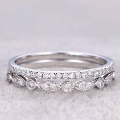 a wedding band with three rows of diamonds on the top and bottom, set in white gold