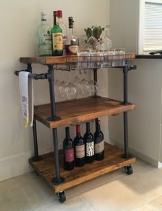 a wooden shelf with bottles and glasses on it