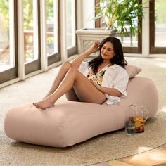 a woman sitting on a bean bag chair