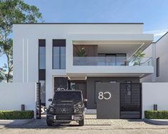 a black jeep parked in front of a white building