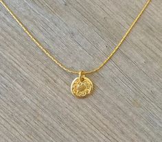 "This necklace is unique and delicate. Wear this alone, or layer it with your other favorites for an earthy, eclectic look. A tiny handcrafted high quality 18k gold plated over brass beautiful textured disc is gently suspended from a delicate 14k gold filled chain. ❉ F A C T S total length : 16\" (41 cm) of a delicate 14k Gold Filled chain pendant length: 0.3\"/ 0.8 cm diameter You will receive the necklace in a gift box ready to be given as a gift. Your necklace may vary slightly from the one i Bohemian Yellow Gold Necklace For Everyday, Everyday Bohemian Charm Necklace With Round Pendant, Bohemian Yellow Gold Necklace For Everyday Wear, Dainty Handmade Medallion Charm Necklace, Dainty Handmade Medallion Charm Necklaces, Dainty Handmade Coin Necklace For Gift, Dainty Handmade Recycled Gold Necklace, Handmade Dainty Coin Necklace As Gift, Handmade Dainty Coin Necklace For Gift