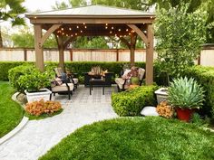 an outdoor patio with seating and lights