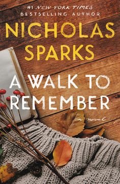 a book cover for a walk to remember by nicholas sparks with autumn leaves and an open book