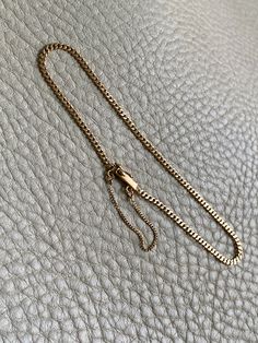 A great budget friendly silky pressed curb link bracelet! Made in 1942 from solid 18k gold, this vintage piece measures 7.5" long and has the silkiest movement. Box clasp is well working with both a safety loop and safety chain. Hallmarked for year, gold purity and the triple crown for Sweden.Excellent vintage condition with normal age related wear. Details Made in 1942 7.5 inch length 2mm width 2.7 grams 18k gold (solid, not plated or fill) Marked for maker, year, gold purity, and the triple cr