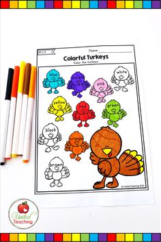 a turkey coloring page with markers and crayon pencils on the table next to it