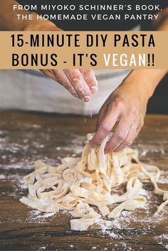 a person is sprinkling pasta with flour on a wooden table