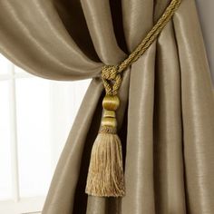 a curtain with a tassel hanging from it