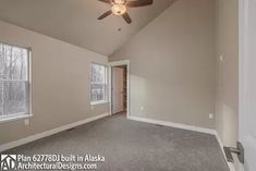 an empty living room with a ceiling fan