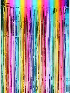 a multicolored background with lots of thin strips of paint on the bottom half