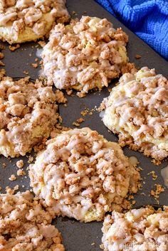 several cookies are on a baking sheet with crumbs