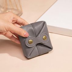 Description: Crafted with high-quality cowhide, this mini wallet offers a compact solution to keep your belongings well-organized. Whether you need a coin wallet, key pouch, or a case for your earphones, this small leather pouch is designed to meet your daily needs effortlessly.  Size: - Height: 3.27 inches (8.3 cm) - Width: 1.30 inches (3.3 cm) - Length: 2.87 inches (7.3 cm) - Weight: 0.088 lb   Delivery Time: - USA: 7-10 days - Europe: 7-12 days - Canada: 10-15 days - Asia: 15-25 days  Give the gift of functionality and style with this Personalized Small Leather Pouch. Perfect for any occasion, this mini genuine coin wallet, key pouch, and earphone case will impress with its practicality and personalized touch. Order yours today and enjoy the convenience and elegance this accessory offer Foldable Rectangular Coin Purse For Daily Use, Versatile Portable Wallet As Gift, Versatile Rectangular Coin Purse As Gift, Versatile Coin Purse With Removable Pouch As Gift, Versatile Rectangular Coin Purse For Gifts, Daily Use Foldable Rectangular Coin Purse, Compact Leather Coin Purse With Zipper, Leather Rectangular Coin Purse With Key Clip, Brown Rectangular Portable Coin Purse