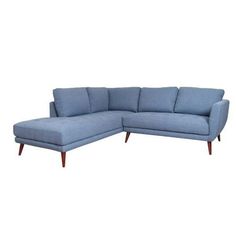 a blue sectional couch sitting on top of a white floor