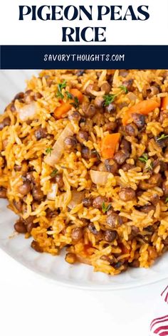 a white plate topped with rice covered in beans and carrots next to a red striped napkin