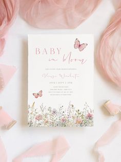 a baby is in the moon card surrounded by pink and white flowers with butterflies on it