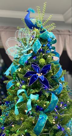 a christmas tree with blue and green decorations