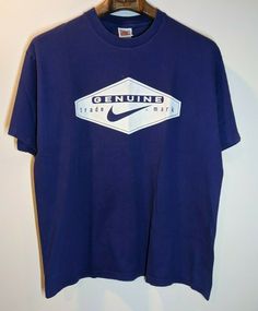 Thanks For Stopping By! Description Vintage 90s Genuine Nike Trademark Spell Out T-Shirt Short Sleeve Size Large ● Condition: Pre-owned ● Size: Large ● Material: Cotton  ● Print/ Embroidery/ Pattern: Nike ● Color: Purple Please note this may be a vintage used item purchased in the United States. For vintage clothing purchase with the understanding that some vintage pieces will show signs of wear. All signs of distress for these items will be shown in the pictures to the best of our ability. Paym Vintage Nike Shirts, Vintage Nike Tee, T-shirt Nike Vintage, Cheap 90s Style Sports T-shirt, Nike Vintage Tshirts, Vintage 1990 Shirt, 90s Sports, Vintage Football, Nike Shirts