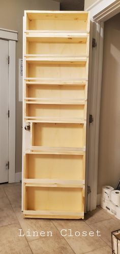 an unfinished bookcase in the corner of a room