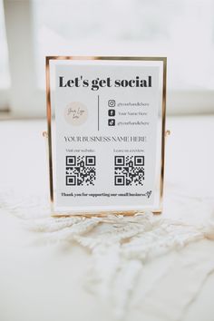 a sign that says let's get social with qr code stickers on it