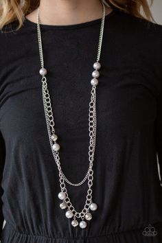 A collection of oversized gray pearls gives way to mismatched layers of silver chains down the chest for an asymmetrical look. Dotted with oversized gray pearls and shiny silver beads, a matching beaded fringe swings from the bottom of the lowermost chain for a modern twist. Features an adjustable clasp closure. Sold as one individual necklace. Includes one pair of matching earrings. Grey Pearl Necklace, Silver Pearl Necklace, Silver Chains, Paparazzi Accessories, Modern Necklaces, Beaded Fringe, Paparazzi Jewelry, Pearl Grey, Shiny Silver