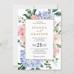 a wedding card with watercolor flowers and greenery on the front, in gold foil