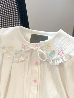 This Kawaii Embroidery Lace Blouse is perfect for any special occasion. Crafted from luxurious eyelash lace, this semi-sheer blouse is an elegant addition to your wardrobe. With a unique embroidery detail, it adds a touch of style and sophistication. this top is sure to move you from ordinary to extraordinary. Kawaii Embroidery, Spring Blouse, White Lace Shirt, Peter Pan Collar Shirt, Spring Blouses, Unique Embroidery, Japanese Kawaii, Sandy Liang, Embroidery Top