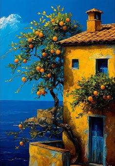 an orange tree in front of a yellow building by the ocean with blue sky and clouds