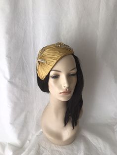 This vintage inspired gold pleated silk dupioni half hat fascinator with gold and silk rhinestone trim. This gold headpiece is perfect to wear as a bridal Juliet Cap, women's formal church hat, derby style tea parties, mother of the bride hat, wedding guest hat or any other special occasion. Please note this is handmade by order and so the pleating maybe slightly different from the one shown. We pride ourselves on making sure you receive a beautifully designed headpiece that's truly yours. Easy Gold Gatsby Evening Headpieces, Gold Gatsby Headpieces For Evening, Gold Gatsby Style Formal Headpieces, Elegant Gold Headpieces For Vintage Events, Elegant Fascinator Headband For Vintage Events, Gatsby Style Evening Fascinator Headband, Elegant Headband Fascinator For Vintage Events, Vintage Gold Fascinator For Wedding, Evening Gatsby Style Fascinator Headband