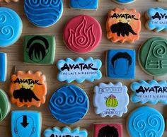 cookies with avatar designs on them sitting on a table