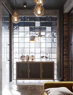 a living room filled with furniture and lots of windows