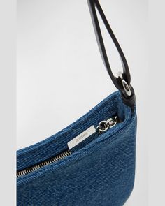 Jacquemus "Le Bisou Perle" shoulder bag in denim cotton and leather    Features signature logo lettering     Adjustable shoulder strap with beaded accent     Zip top closure     Interior, one card slot     Lining: Cotton    Approx. 5.5"H x 9.1"W x 2.8"D    Made in Italy Jacquemus Denim Bag, Designer Denim Shoulder Bag With Branded Hardware, Luxury Denim Blue Women's Shoulder Bag, Denim Shoulder Bag With Branded Hardware, Denim Shoulder Bag, On-the-go Denim Shoulder Bag With Zipper Pocket, Denim Shoulder Bags, Denim Cotton, Mini Handbags