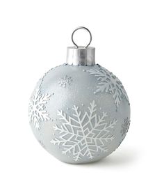 a silver ornament with snowflakes on it