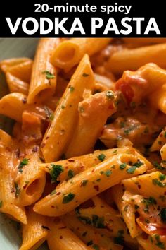 a bowl filled with pasta covered in sauce