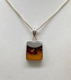 Beautiful Vintage Art Deco 925 Sterling Silver & Amber Pendant Necklace pre/owned condition chain measures 18" inches length. Silver Rectangular Necklace With Polished Finish, Amber Hallmarked Necklace For Anniversary, Amber Necklace Hallmarked For Anniversary, Sterling Silver Necklace With Amber Round Pendant, Unique Sterling Silver Rectangular Necklace, Unique Rectangular Sterling Silver Necklace, Sterling Silver Necklace With Large Amber Pendant, Amber Sterling Silver Necklace With Polished Finish, Amber Necklace With Polished Finish For Anniversary