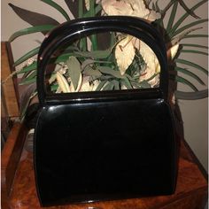 Gorgeous Rare Vintage Palomo Picasso Black Patent Leather Handbag. Snap Handles A Top Are A Patented Design. Black Leather Interior With One Zippered Pocket. Gold Tone Hardware. Euvc ( Excellent Used Vintage Condition). Includes Generic Dust Bag. 5 Star Seller. 10% Discount On A Bundle Of Three Or More Items Paloma Picasso Bag, Vintage Black Shoulder Bag With Brass Hardware, Paloma Picasso Jewelry, Black Saffiano Leather Bag With Gold-tone Hardware, Black Vintage Bag With Snap Closure, Paloma Picasso, Patent Leather Handbags, Leather Interior, Black Patent Leather