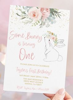 someone is holding up a birthday card with flowers on it and the words, some bunny is turning one