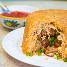 a sandwich cut in half sitting on top of a white plate