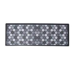 a black and white rug with hexagonal tiles on it's sides,