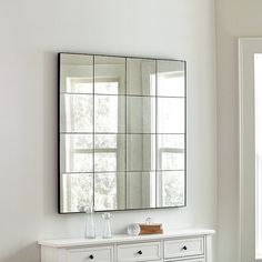 a bathroom with a sink and mirror on the wall