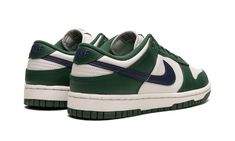 The Women’s Nike Dunk Low "Gorge Green" is a women’s-exclusive colorway of the vintage basketball shoe that’s reminiscent of the model’s “Spartan Green” design, but with a few subtle differences.  The “Gorge Green” features the same white-and-green color block as the “Spartan Green” Dunk, but with a navy leather Swoosh on the sides instead of a green Swoosh.  More specifically, the “Gorge Green” has a white leather base and Gorge Green leather overlays.  Navy “Nike” branding is embroidered on th Nike Dunk Low Vintage Green, Adidas Sl 72, Sneakers Box, Kobe Shoes, Adidas Spezial, Sneaker Release, Nike Brand, Jordan 3, Green Shoes